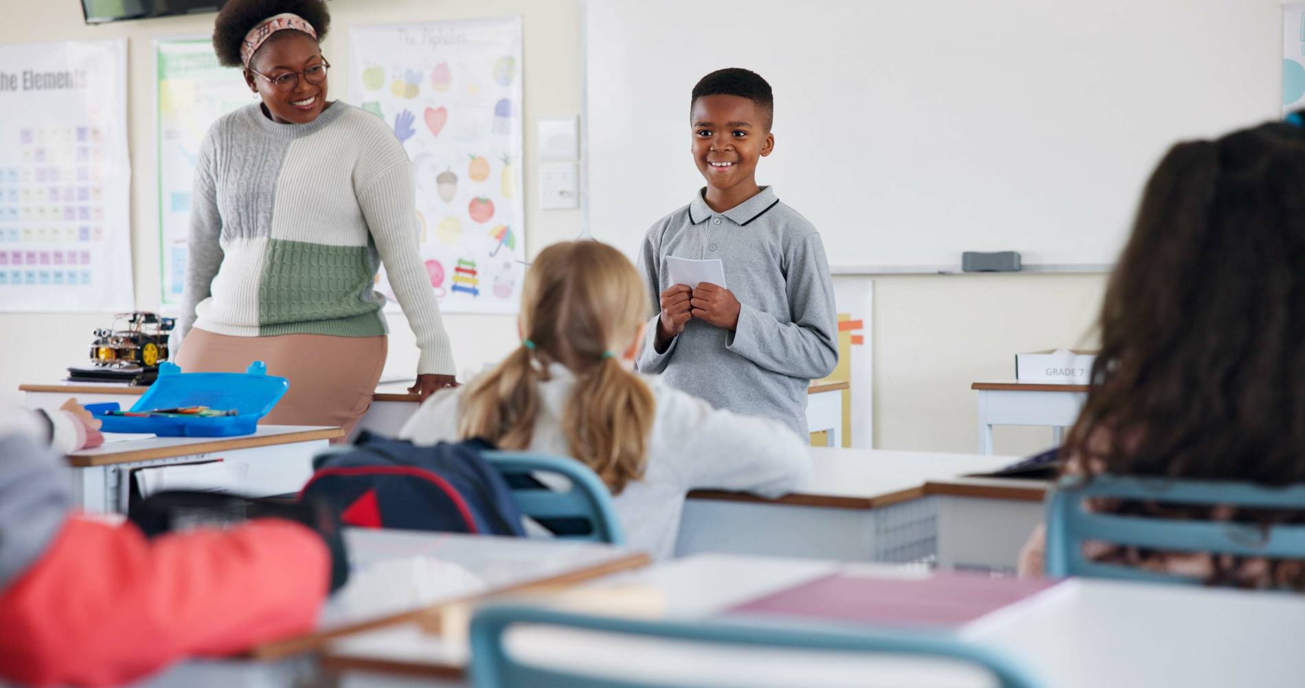 A school leader working with students